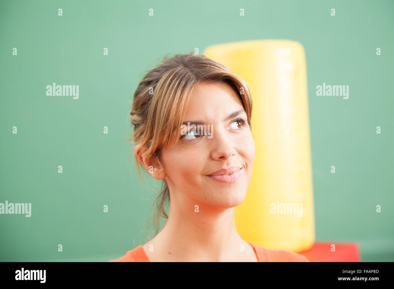 Teacher smiling at school Stock Photo - Alamy