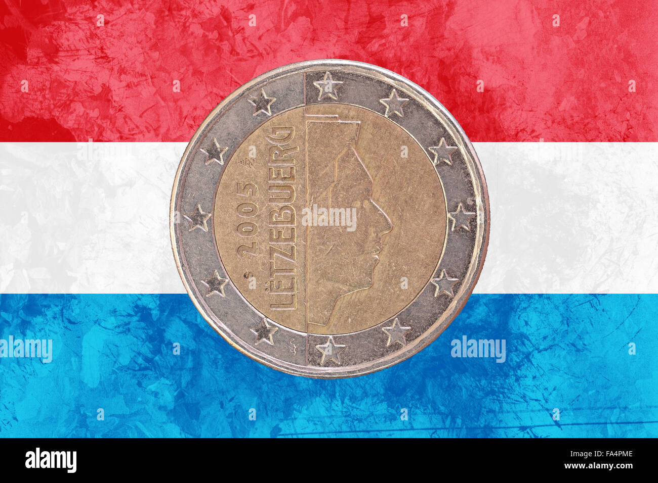 Two euros coin from Luxembourg isolated on the national luxembourgish flag as background Stock Photo