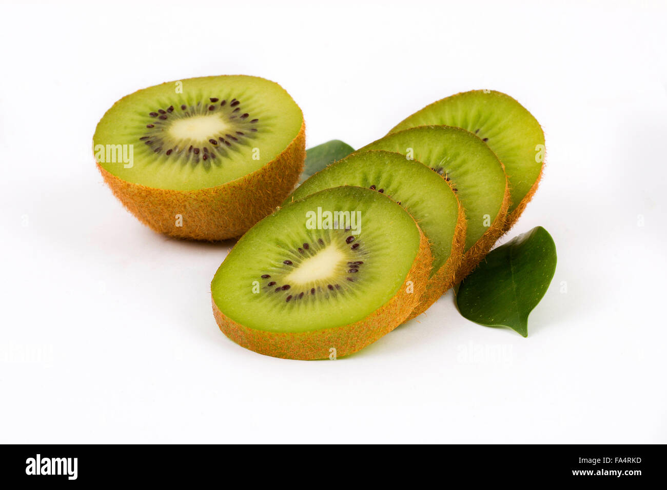 Fresh kiwi with slices and leaves Stock Photo