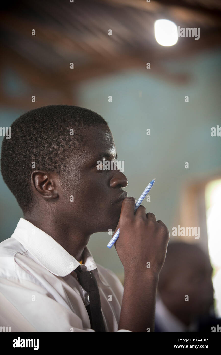 Students attend school in a classroom lit by solar power in Nyarubanda village, Kigoma Region, Western Tanzania. Stock Photo