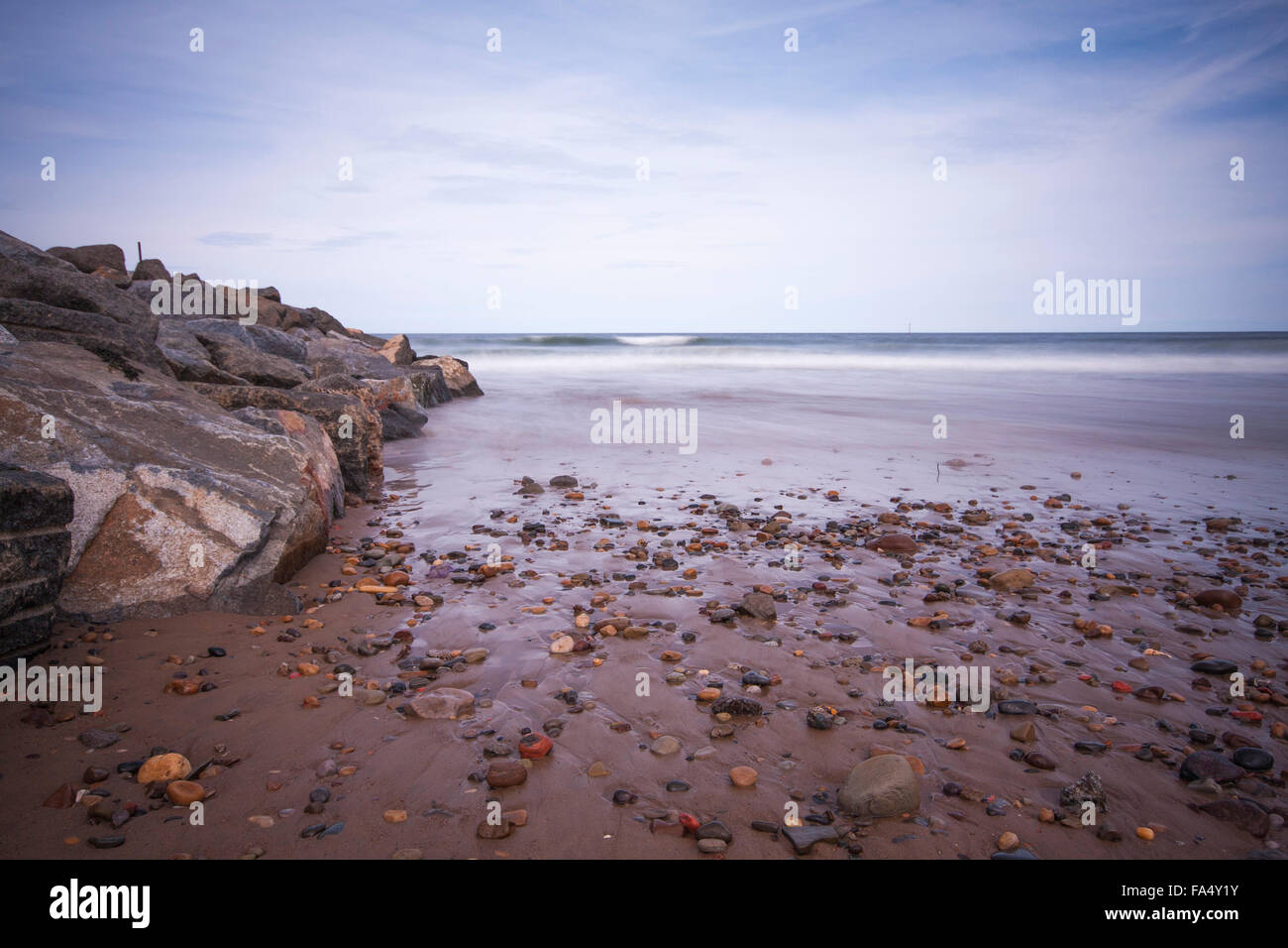 Close up of the receding tides,sands and rocks at Skinningrove beach,Redcar and Cleveland,England,UK Stock Photo