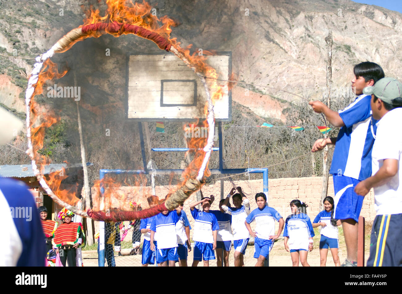 Bolivian youths jumping through rings of fire at the 500 year