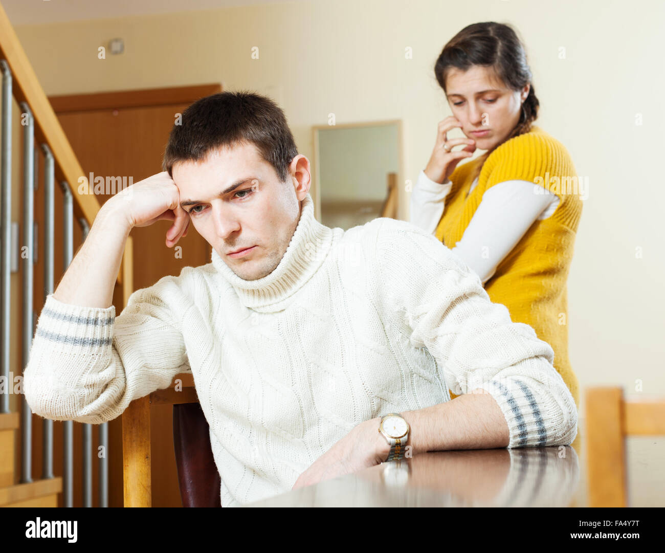 Upset ordinary man against unhappy woman at home Stock Photo - Alamy