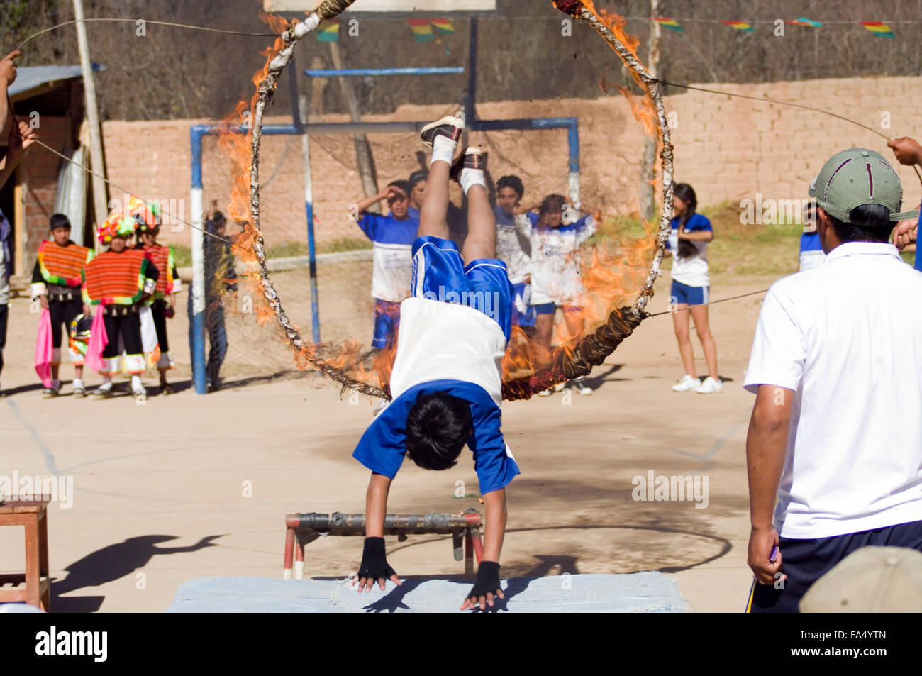 Bolivian youths jumping through rings of fire at the 500 year