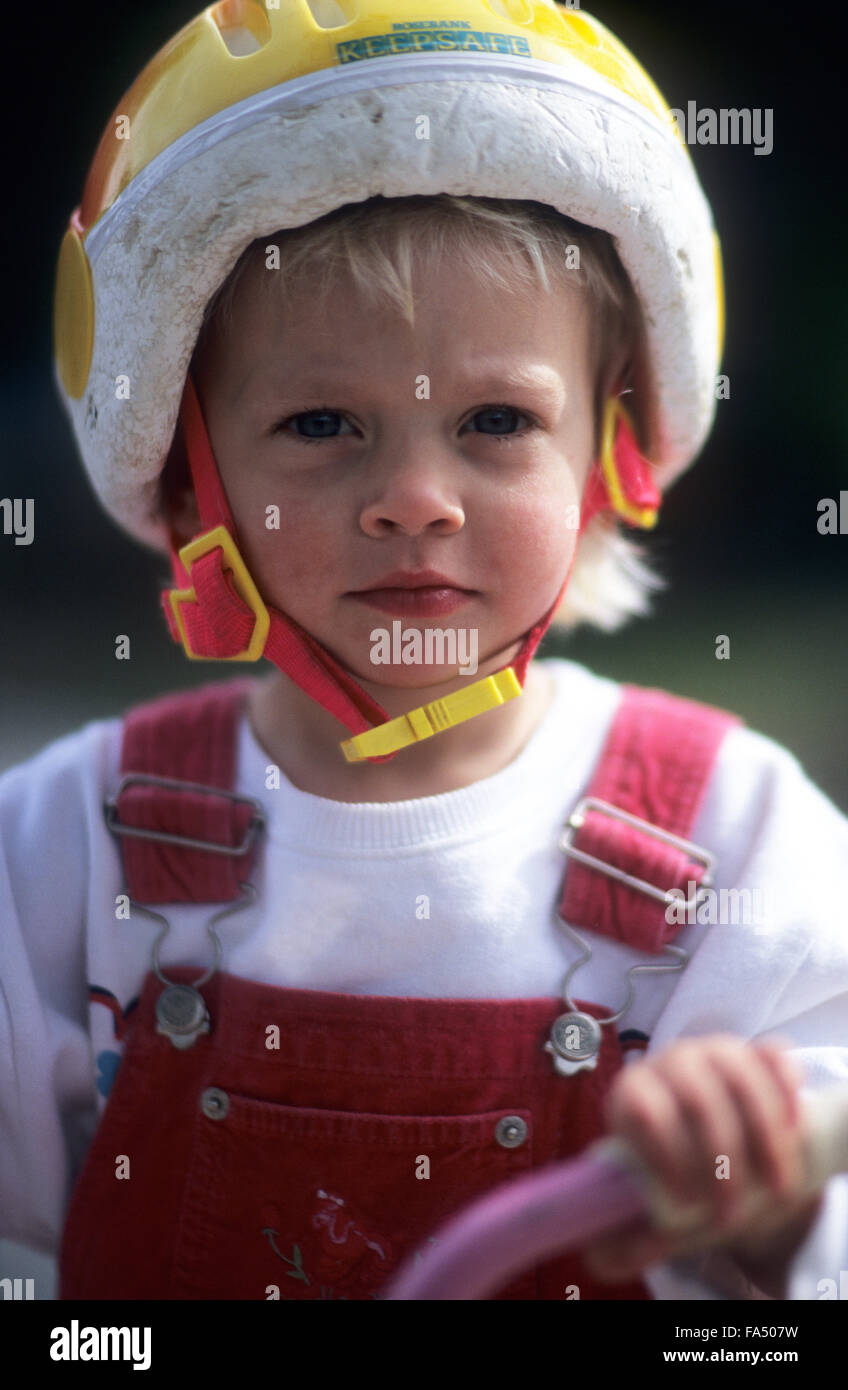 Child, age 3 years on bicycle with cycle helmet Stock Photo Alamy