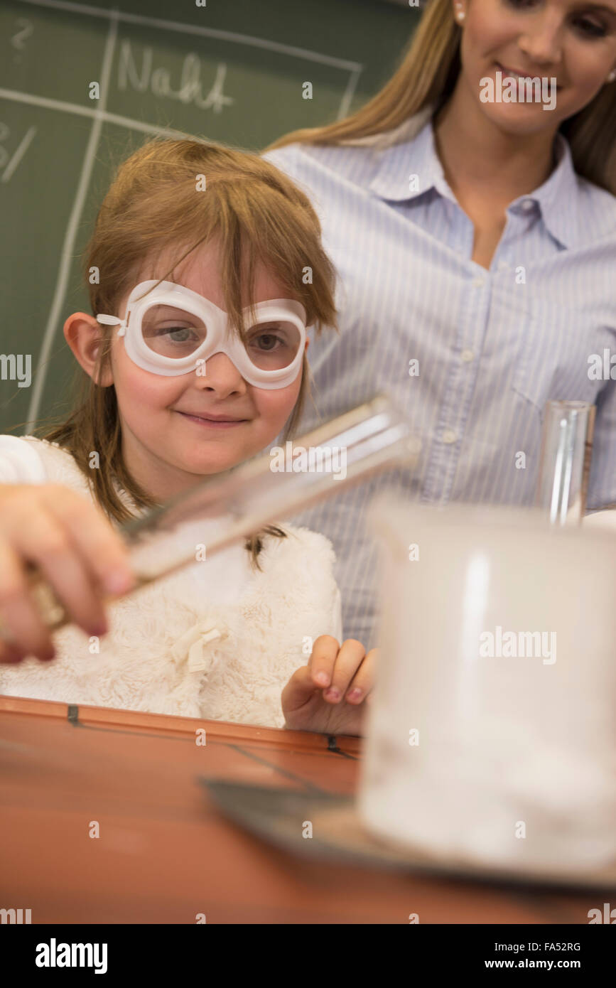 Schoolgirl and teacher conducting scientific experiments, Fürstenfeldbruck, Bavaria, Germany Stock Photo