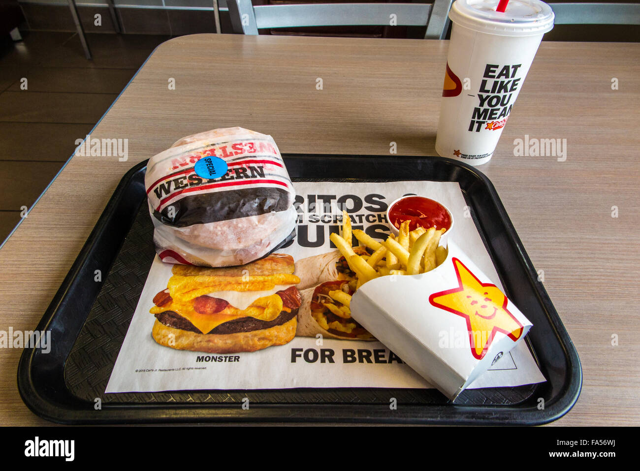 A Carls Jr. meal with hamburger, fries, and a drink Stock Photo Alamy
