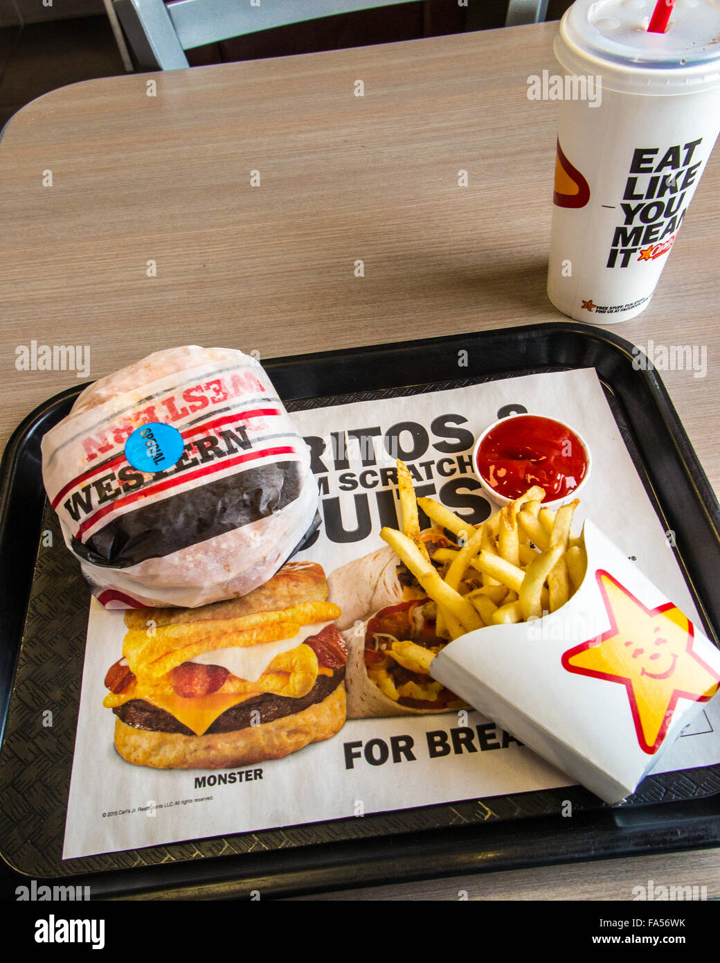 A Carls Jr. meal with hamburger, fries, and a drink Stock Photo Alamy