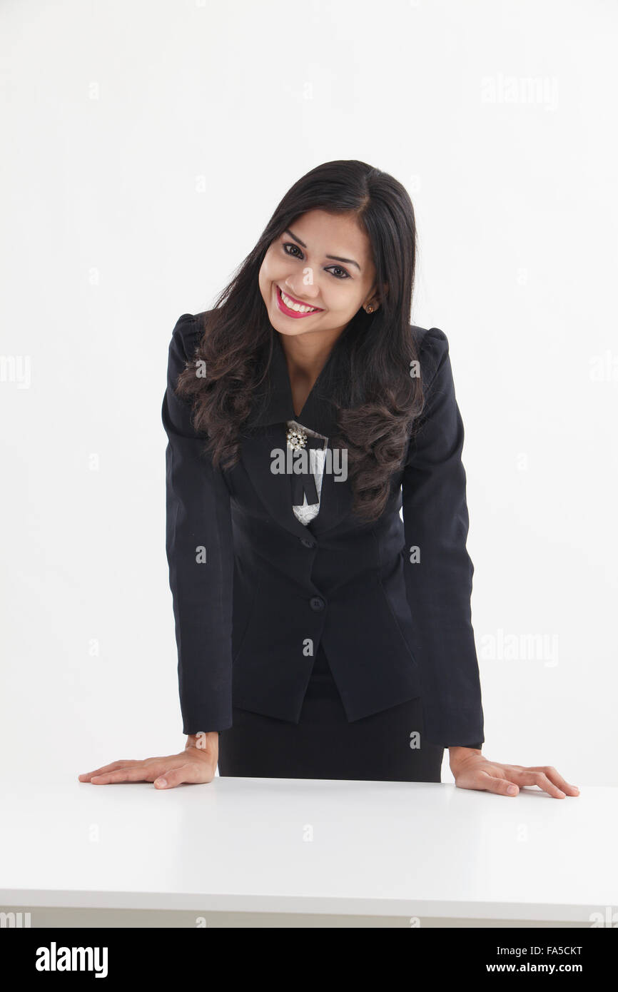 businesswoman standing behind of the desk confident Stock Photo - Alamy