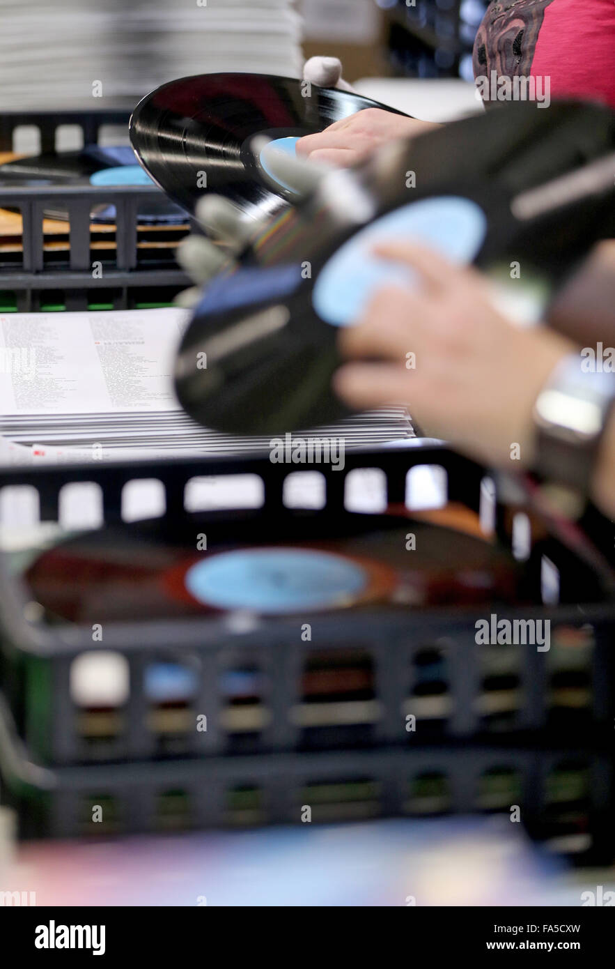 Stollberg, Germany. 3rd Dec, 2015. Employees of Celebrate Records package records at the pressing plant in Stollberg, Germany, 3 December 2015. According to the Bundesverband Musikindustrie (music industry association), the LP record has been making a comeback for several years. In 2014 around 1.8 million records worth 38 million euros were sold, the most since 1992. At Celebrate Records, around 40 employees produce more than 2 million records each year. Around 70 per cent are exported. PHOTO: JAN WOITAS/DPA/Alamy Live News Stock Photo