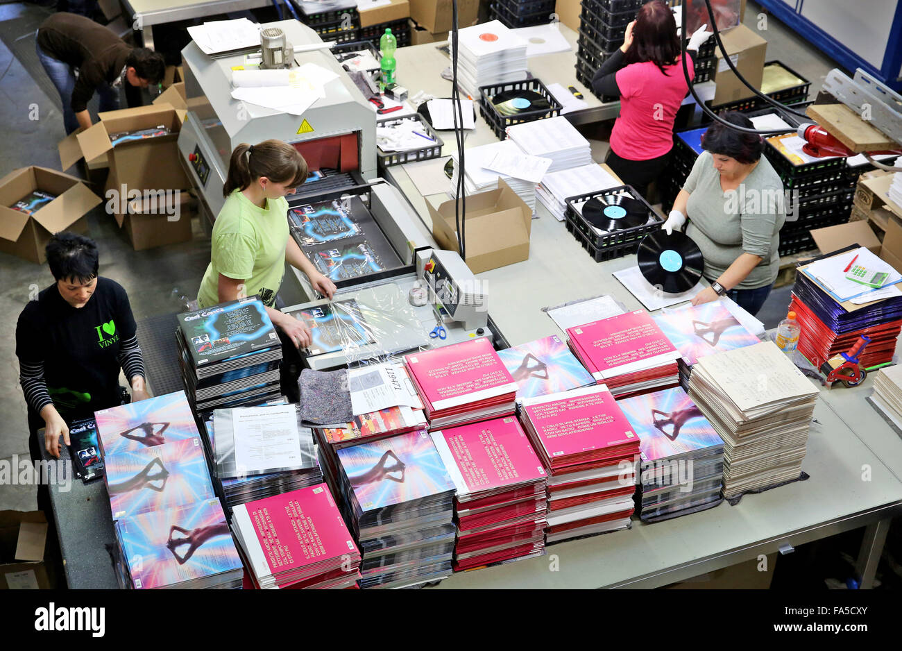 Stollberg, Germany. 3rd Dec, 2015. Employees of Celebrate Records package records at the pressing plant in Stollberg, Germany, 3 December 2015. According to the Bundesverband Musikindustrie (music industry association), the LP record has been making a comeback for several years. In 2014 around 1.8 million records worth 38 million euros were sold, the most since 1992. At Celebrate Records, around 40 employees produce more than 2 million records each year. Around 70 per cent are exported. PHOTO: JAN WOITAS/DPA/Alamy Live News Stock Photo