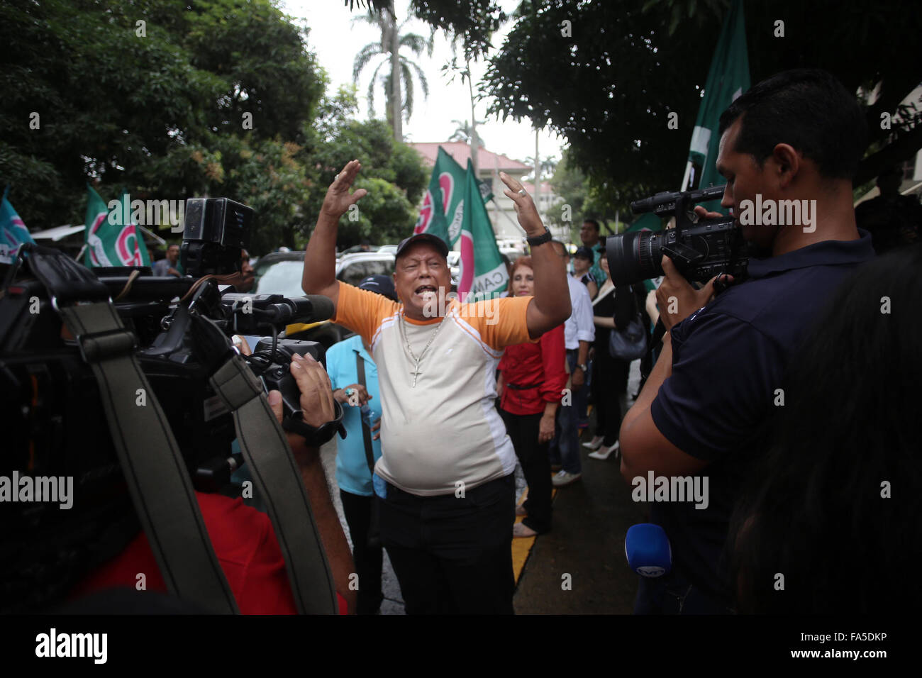Panama City, Panama. 21st Dec, 2015. Members of the political party 'Democratic Change' shout slogans in front of the Supreme Court of Justice in Panama City, capital of Panama, on Dec. 21, 2015. According to local press, the plenary of the Supreme Court of Justice held on Monday an oral and public audience, aiming to consider the request of provisional detention against the former Panamanian president (2009-2014) and deputy of the Central American Parliament, Ricardo Martinelli. Credit:  Mauricio Valenzuela/Xinhua/Alamy Live News Stock Photo