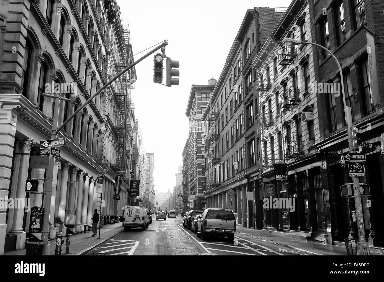 NEW YORK CITY, USA - DECEMBER 10, 2015: Downtown streets lined in traditional architecture in SoHo Cast Iron Historic District. Stock Photo