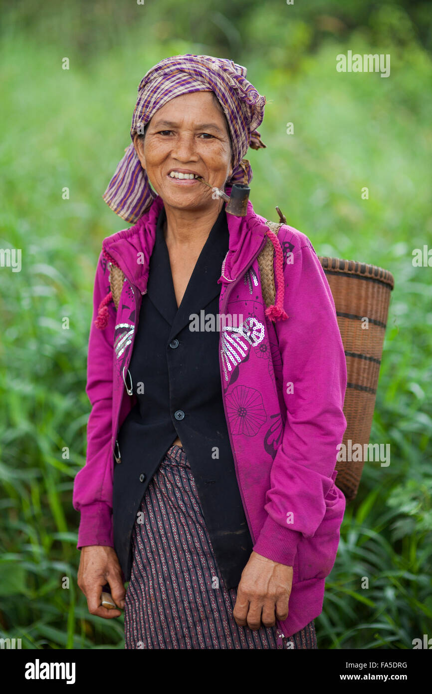 Portrait of a Tompuon woman with pipe | Ratanakiri Province, Cambodia Stock Photo