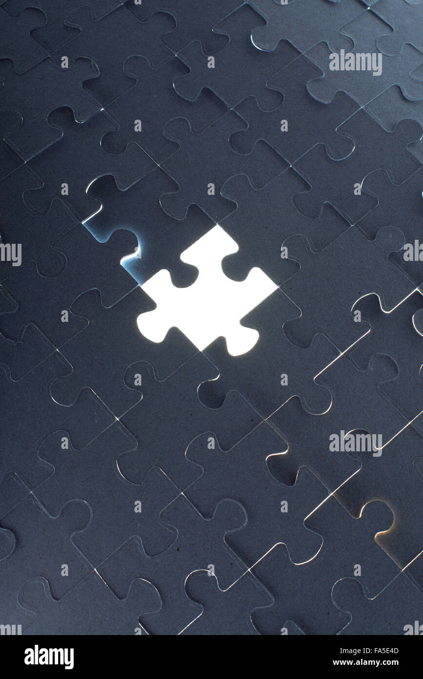 Missing jigsaw puzzle piece with light glow Stock Photo Alamy