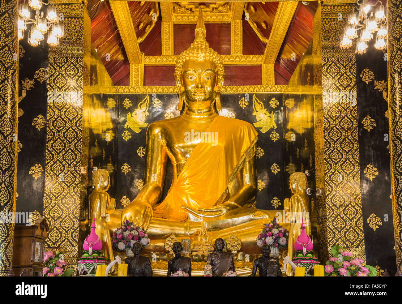 Beautiful Golden Buddha statue inside a temple Stock Photo - Alamy