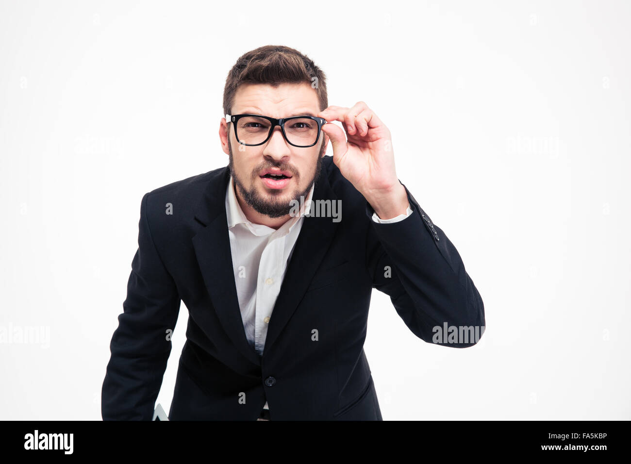 Portrait of a businessman looking at camera isolated on a white ...