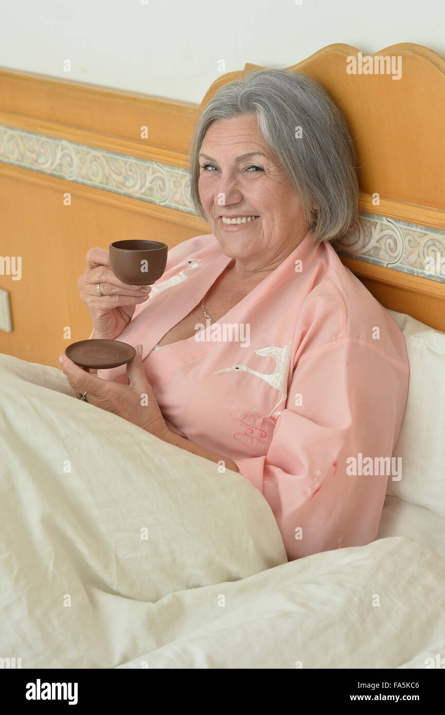 Mature woman with coffee Stock Photo