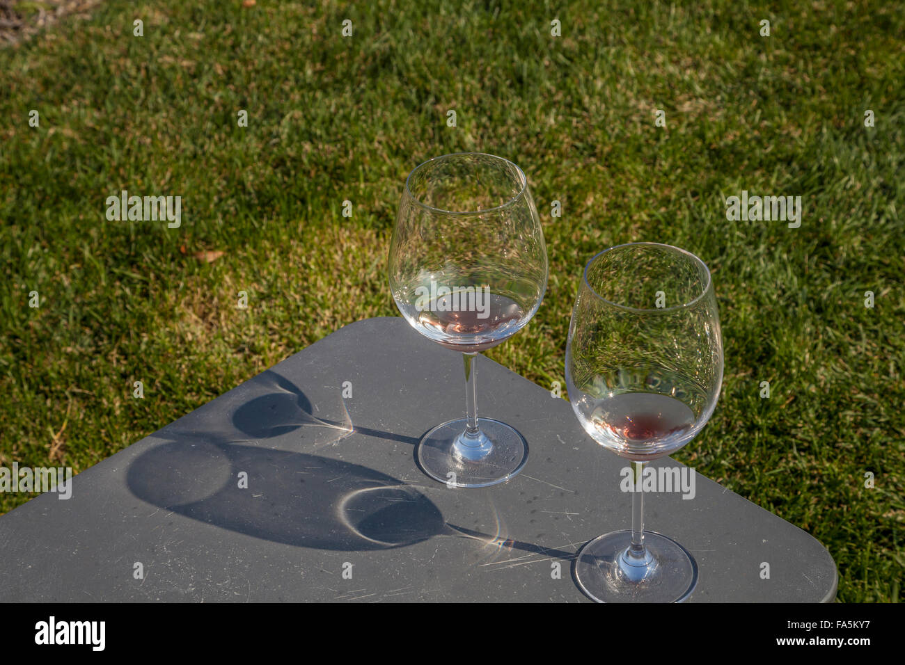 Wineglasses in the picnic area at Ram's Gate Winery, Sonoma, California, USA Stock Photo