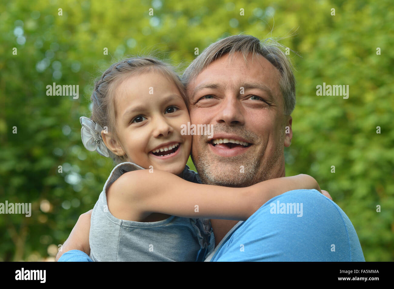 Father with daughter in summer park Stock Photo - Alamy