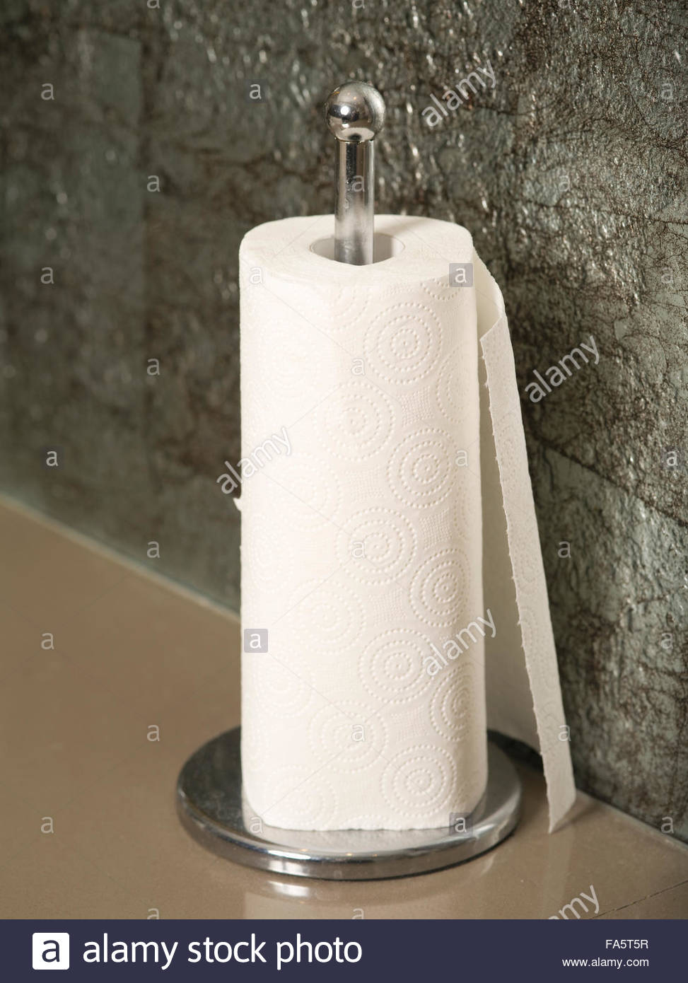 Paper Towel Roll On Countertop With Dispenser Stock Photo