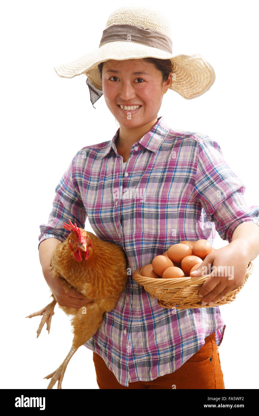 The farmer took the chicken and the egg Stock Photo