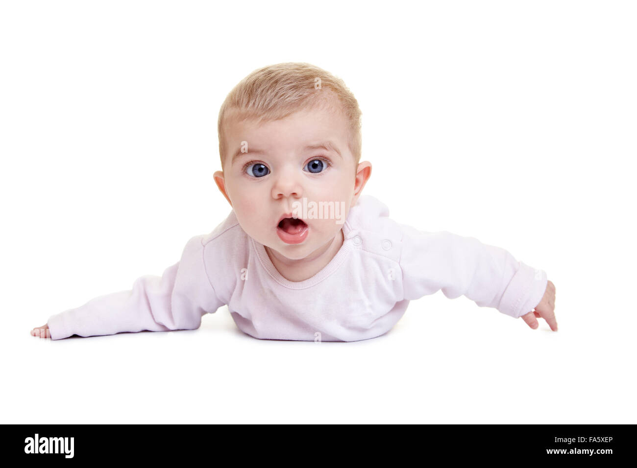 Amazed baby laying on floor with open mouth Stock Photo Alamy
