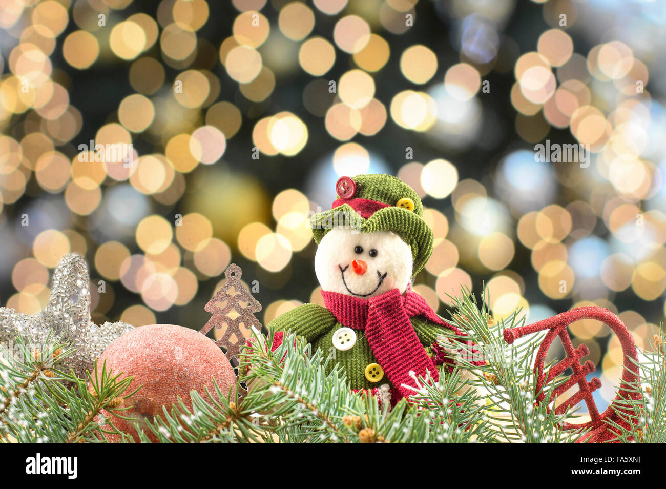 Snowman and Christmas ornaments with Christmas lights bokeh background Stock Photo