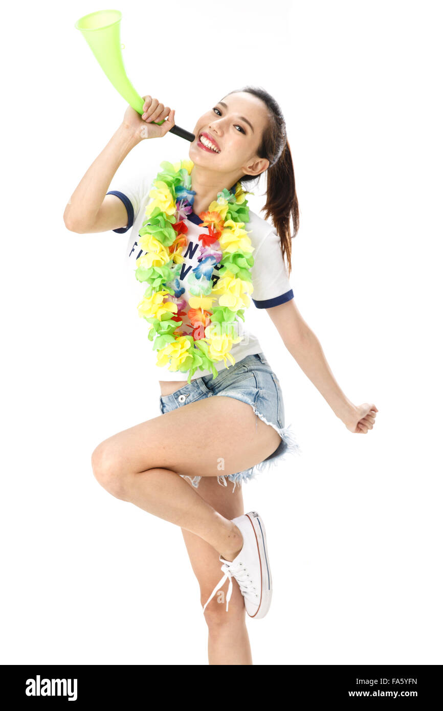 Young woman blowing horn Stock Photo Alamy