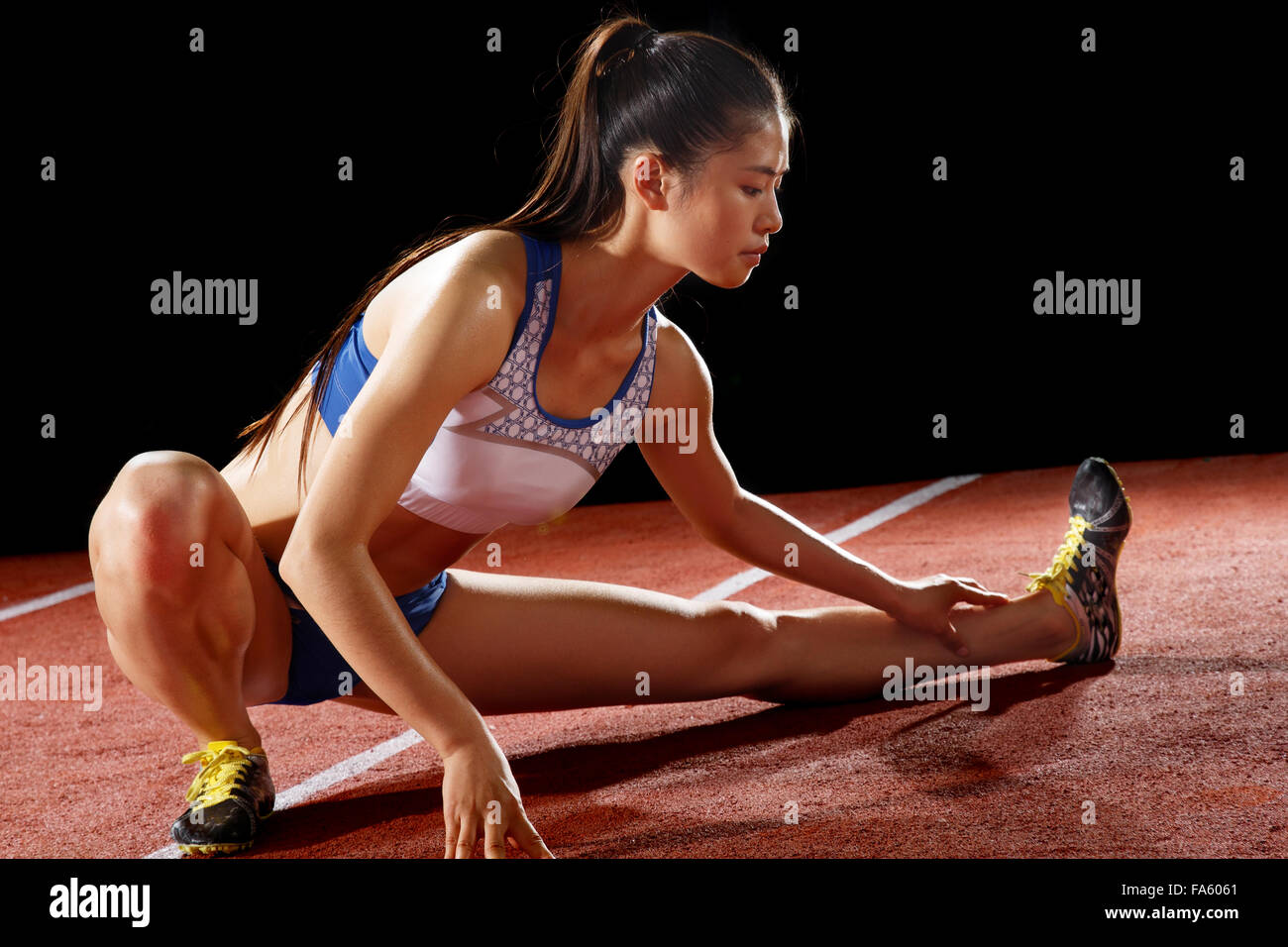 Track and field athletes warmup exercise Stock Photo Alamy