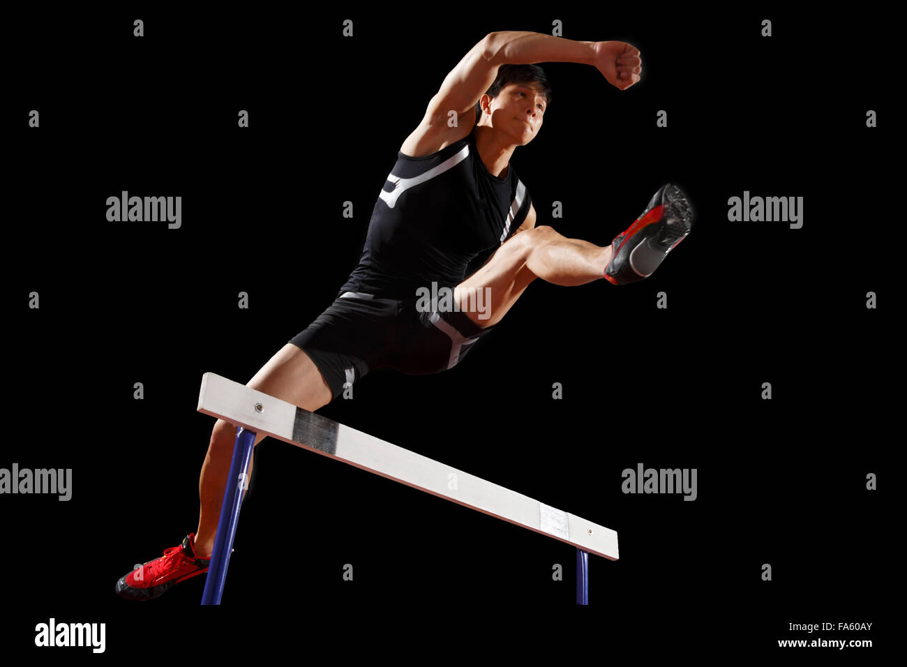 Track and field athletes to do hurdles Stock Photo Alamy