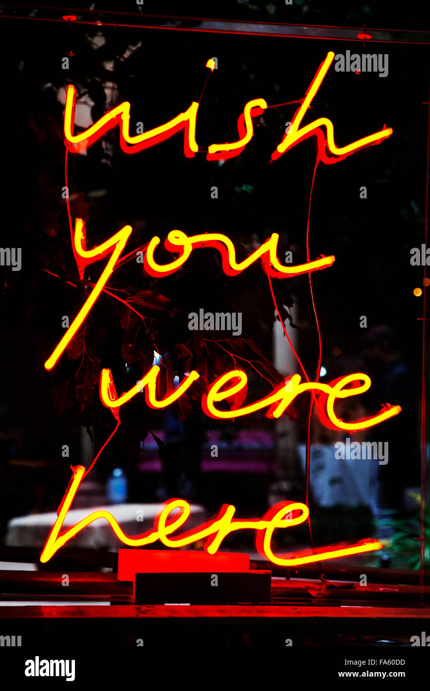 'Wish you were here' in neon lights. Stock Photo
