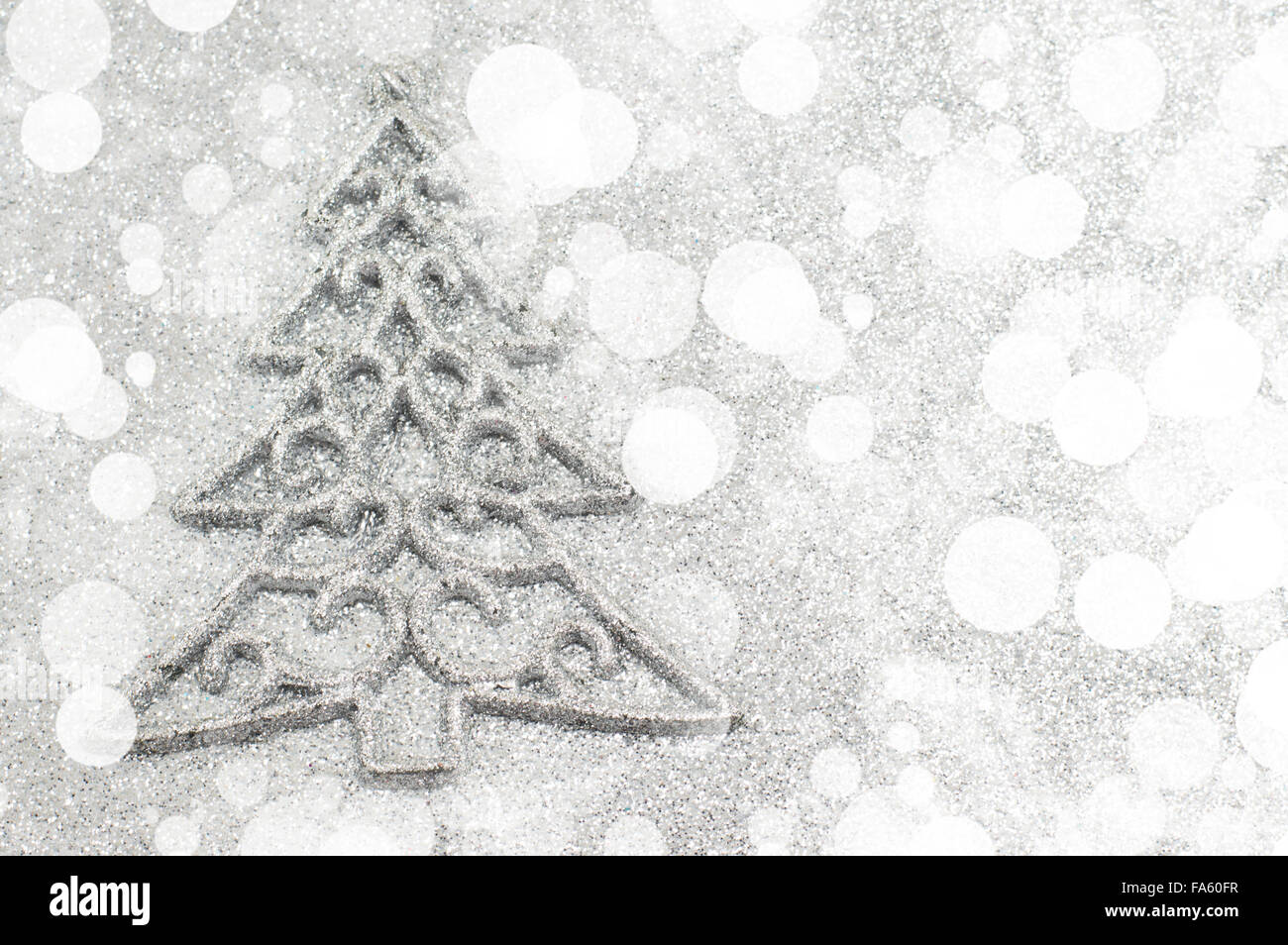 Christmas tree decoration with bokeh silver background. Celebrating Christmas Stock Photo