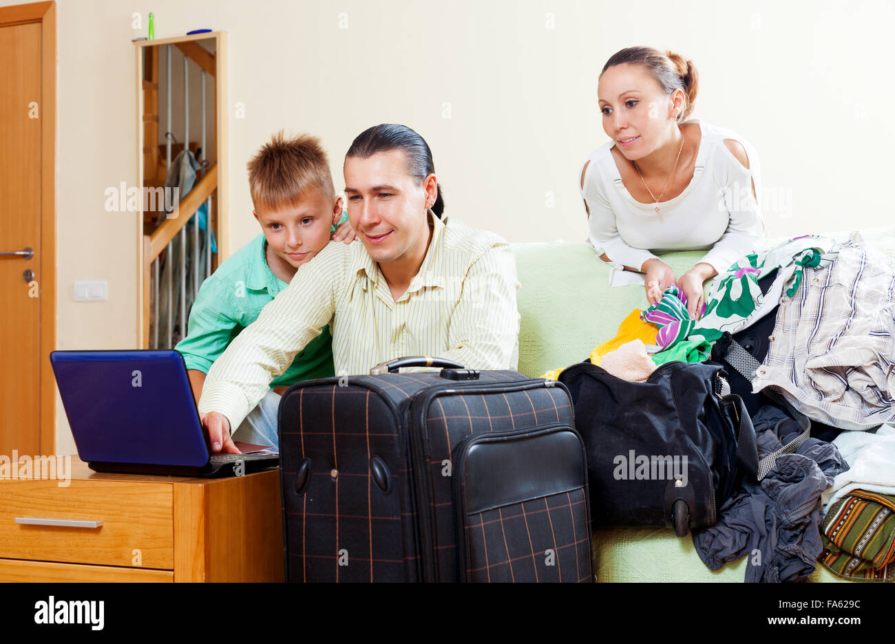 Family Of Three With Teenager Reserving Tickets And Choosing