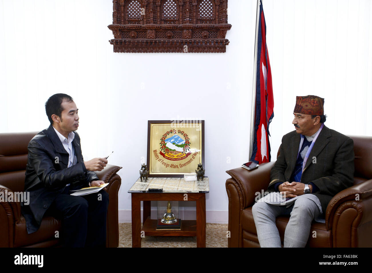 Kathmandu, Nepal. 22nd Dec, 2015. Nepal's Deputy Prime Minister and Minister for Foreign Affairs Kamal Thapa (R) receives an interview with Xinhua before his five-day official visit to China, in Kathmandu, Nepal, Dec. 22, 2015. Kamal Thapa will leave for China on Wednesday. During the visit, Nepal is expected to seal a trade and transit agreement with China as well as finalize the details for importing petroleum products from the northern neighbor on a commercial basis. Credit:  Pratap Thapa/Xinhua/Alamy Live News Stock Photo