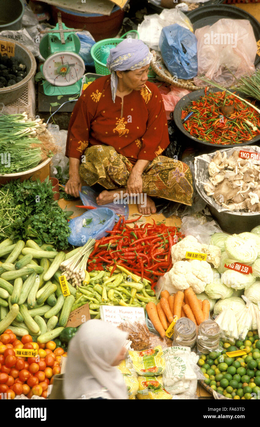 Kelantan State, Kota Bharu, Women selling fruit and vegetables in the towns central market, Malaysia. Stock Photo