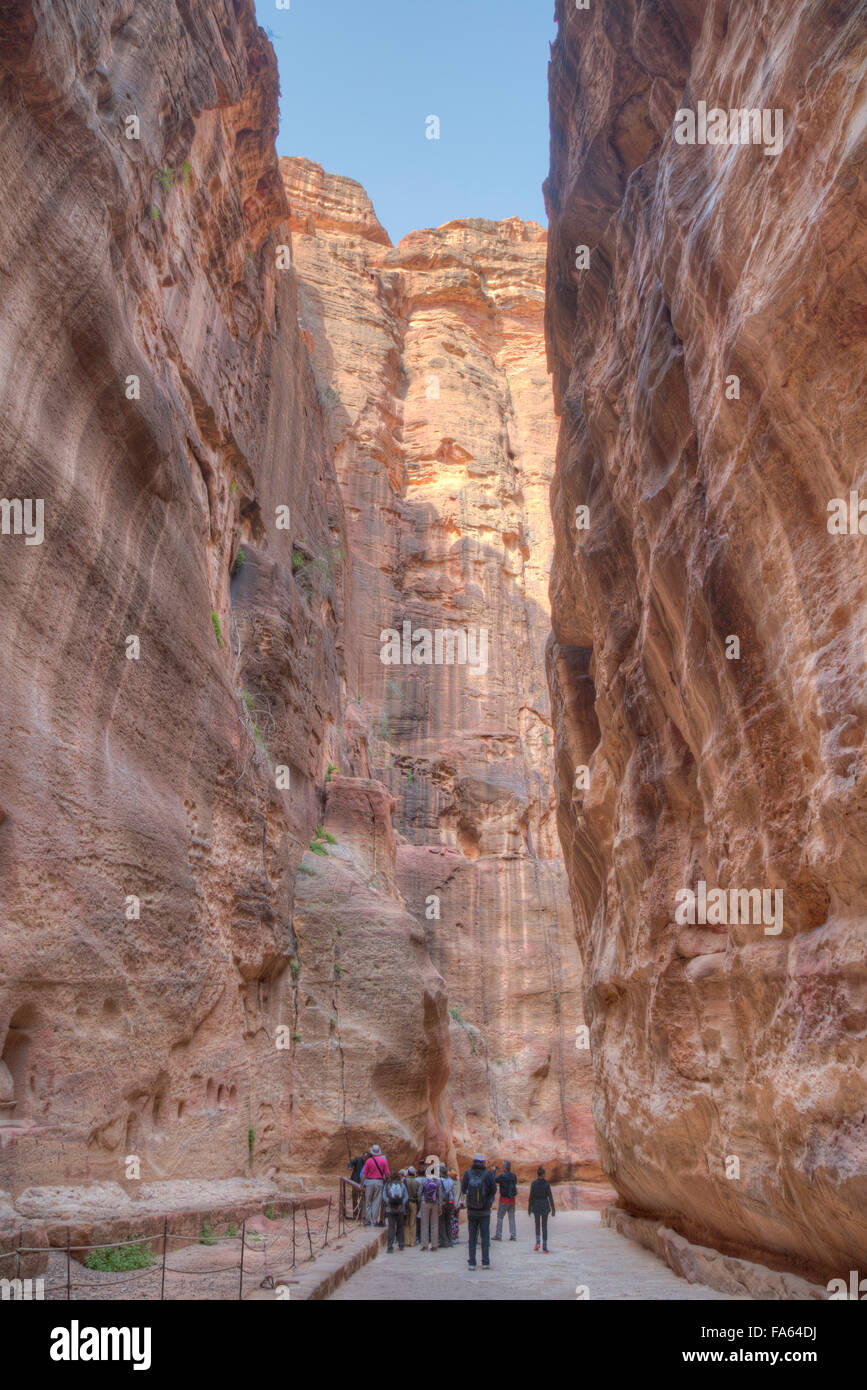 Tourists Walking thru the Sig, Petra, Jordan Stock Photo