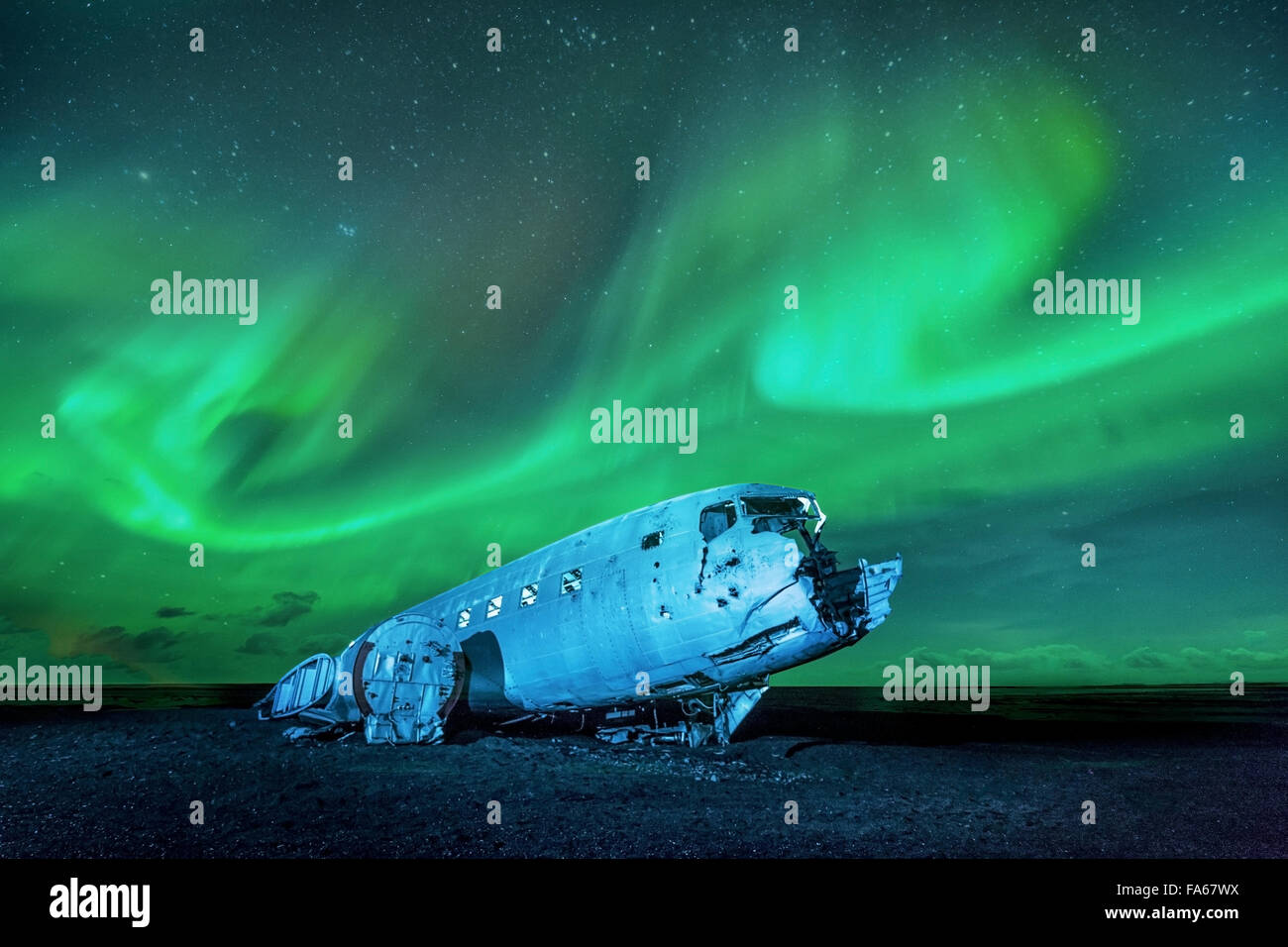 Northern lights over plane wreckage, Iceland Stock Photo