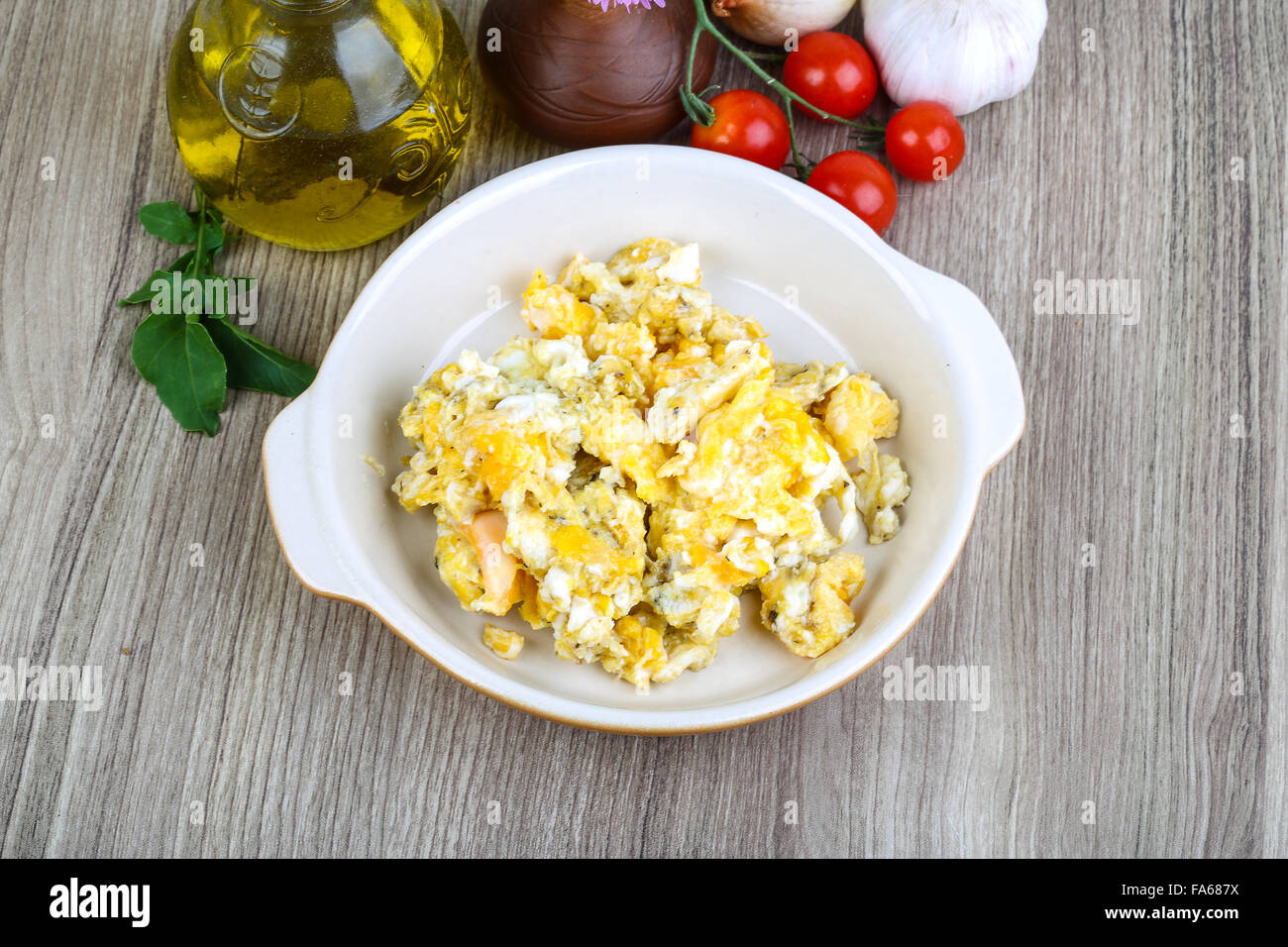 Scrambled eggs for breakfast on the wood background Stock Photo - Alamy