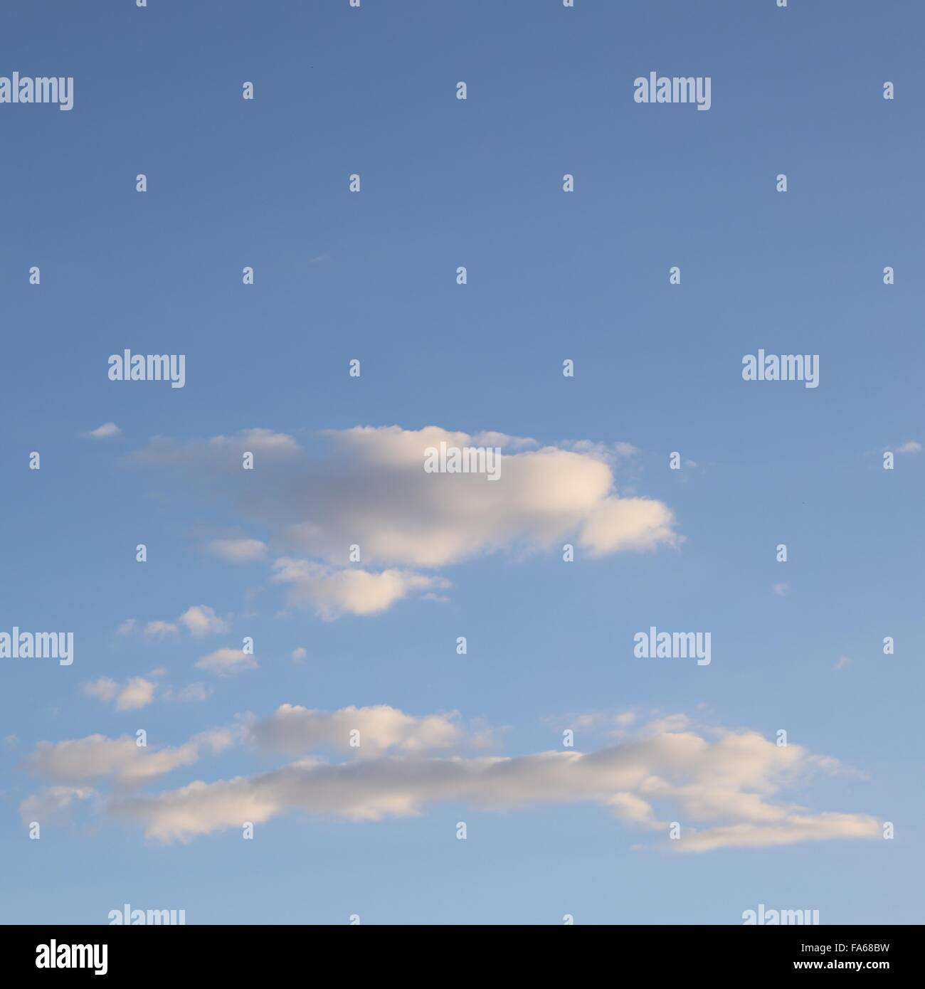 Blue sky with wispy clouds Stock Photo