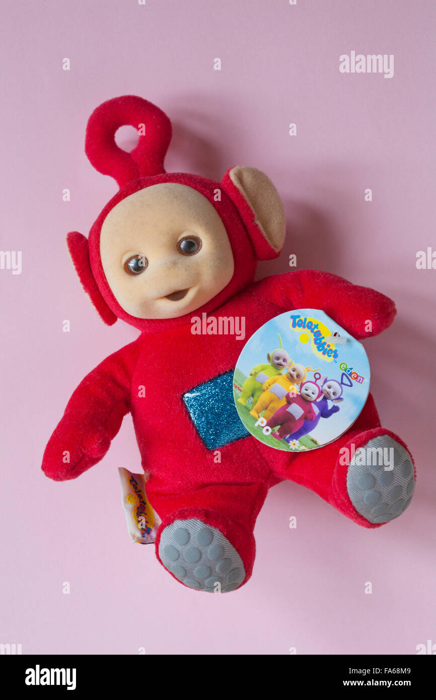 Well loved cuddly Po teletubby doll on pink background Stock Photo