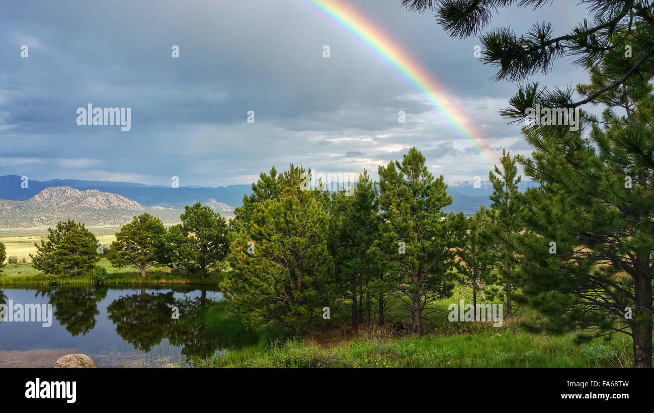 Rainbow over lake, Colorado, United States Stock Photo