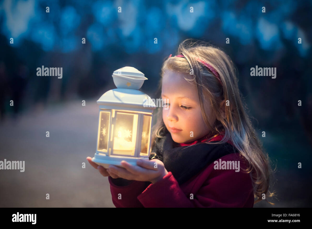 Girl holding a lantern Stock Photo Alamy