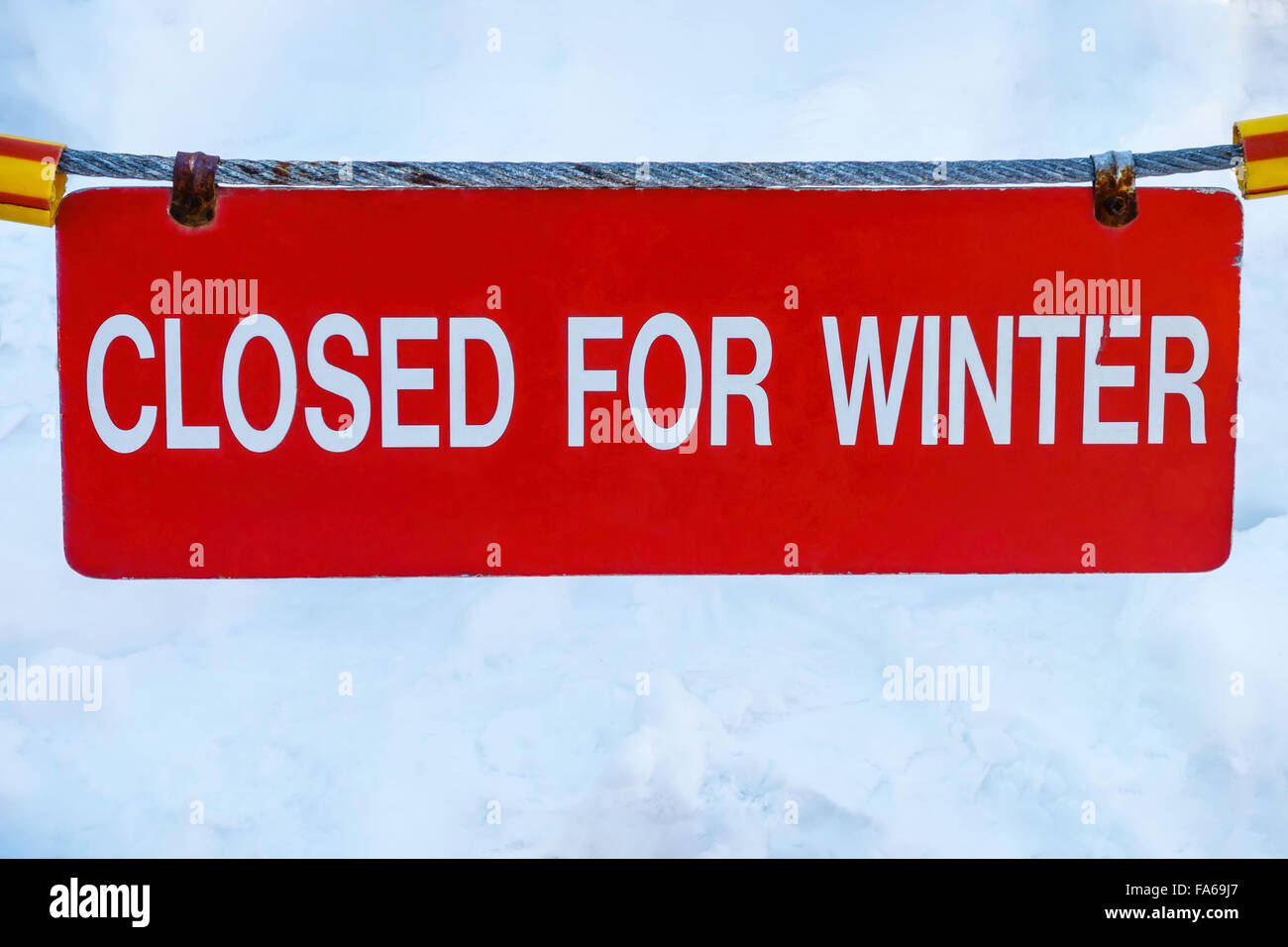Closed for Winter sign hanging on a cable in snow Stock Photo Alamy