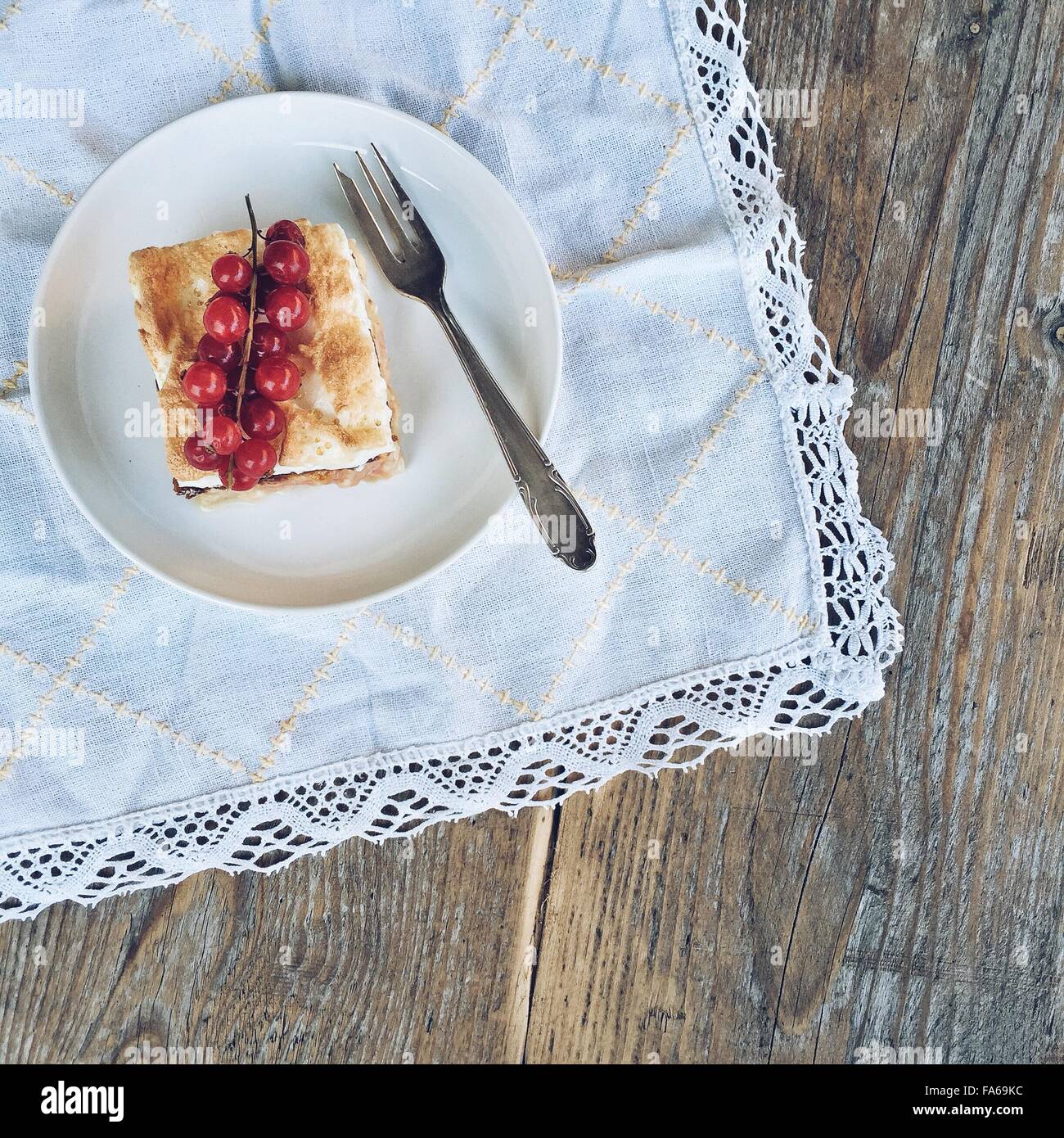 Slice of Rhubarb and meringue cake on a pate Stock Photo