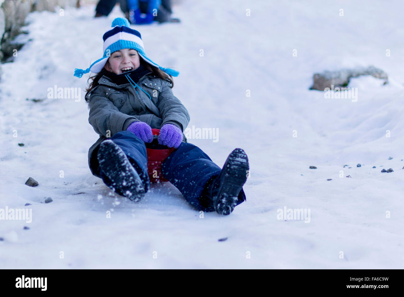 Child sledge sliding snow hires stock photography and images Alamy