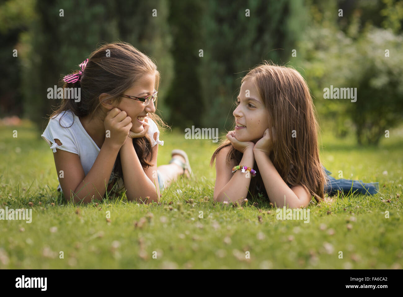 Two girls talking and smiling Stock Photo