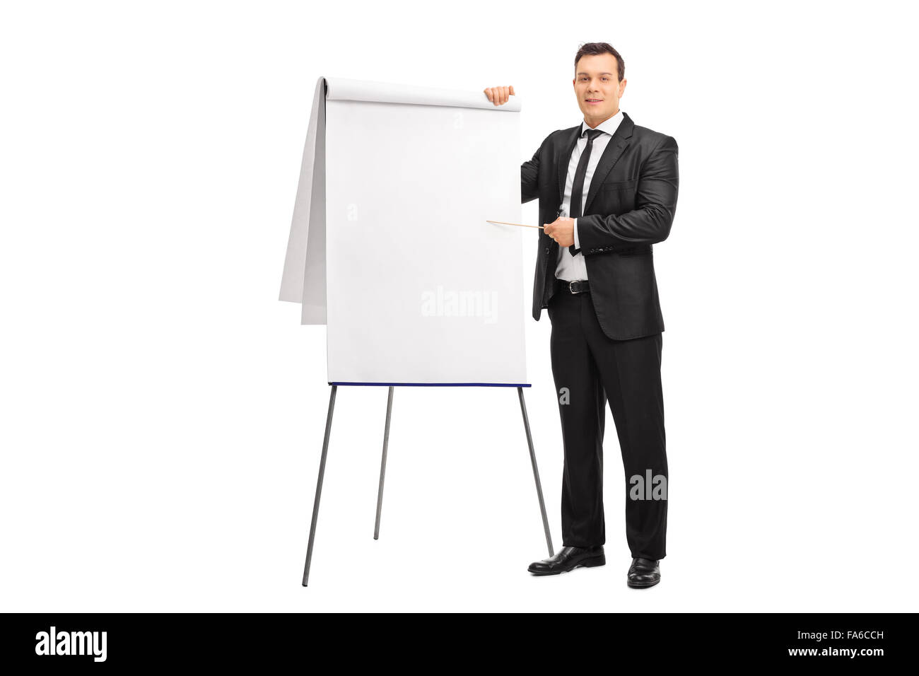 Young businessman pointing on a presentation board with a wooden stick isolated on white background Stock Photo