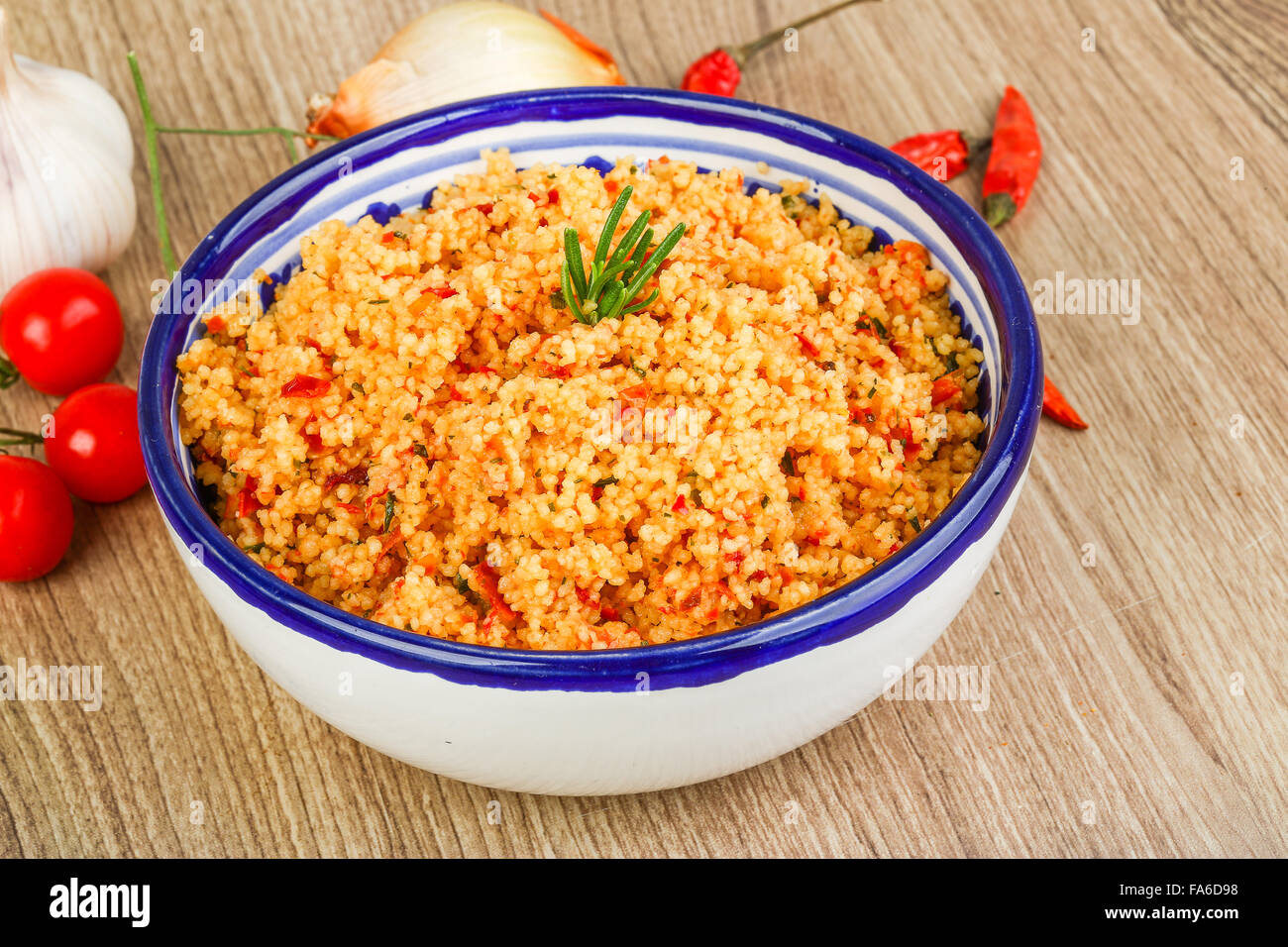 Arabic traditional cuisine Couscous with tomato and green onion Stock
