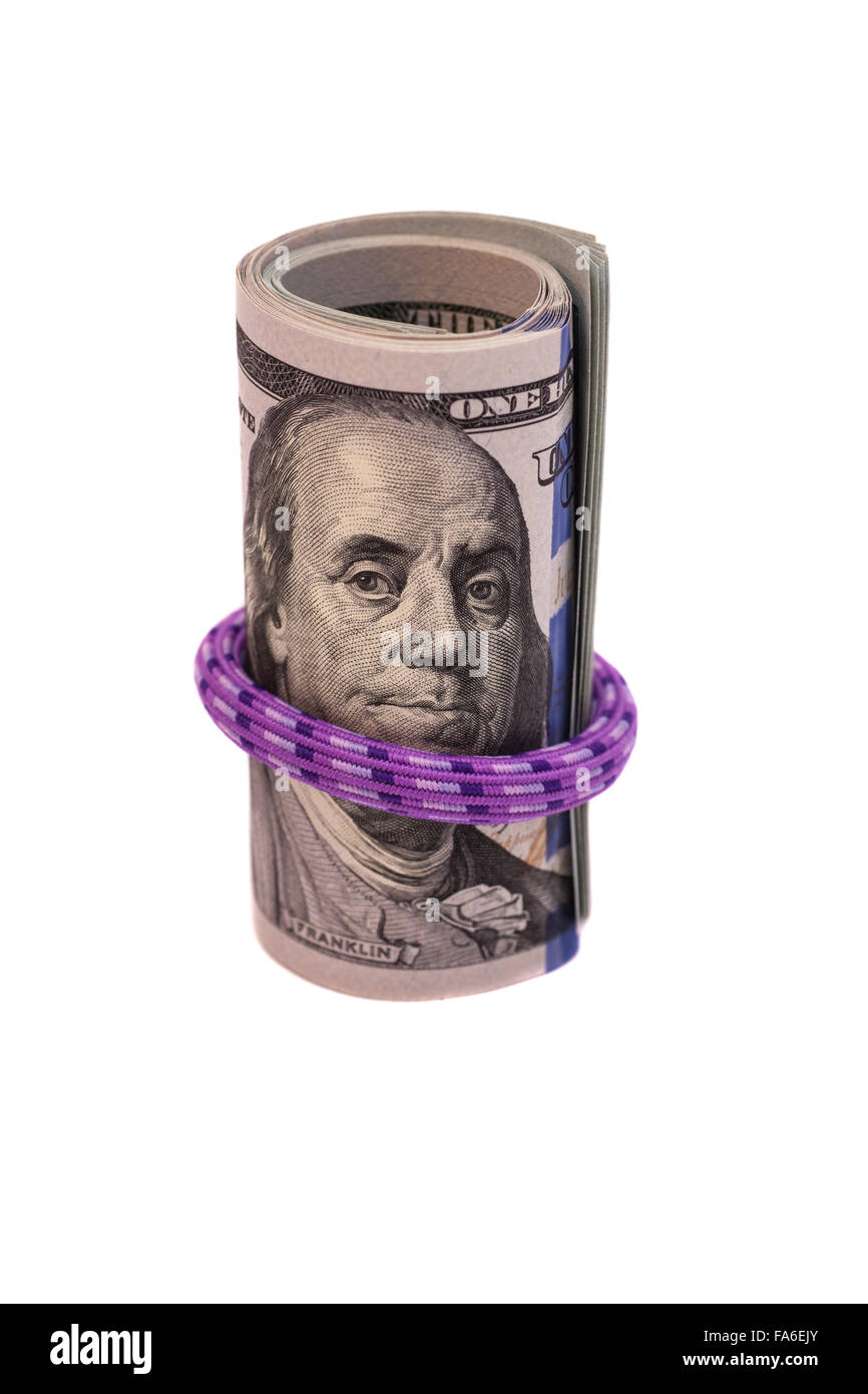 Hundred dollar bills rolled up with rubber band on white Stock Photo